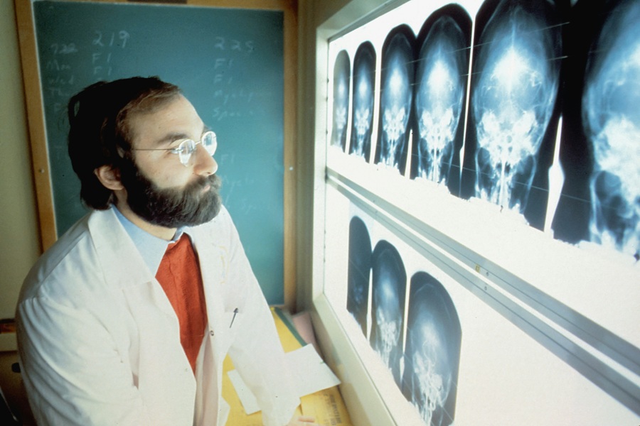 Medical consultant reviewing diagnostic scans relating to medical negligence claims