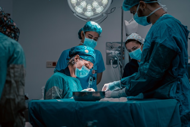 Medical team monitoring a patient during anaesthesia and surgery